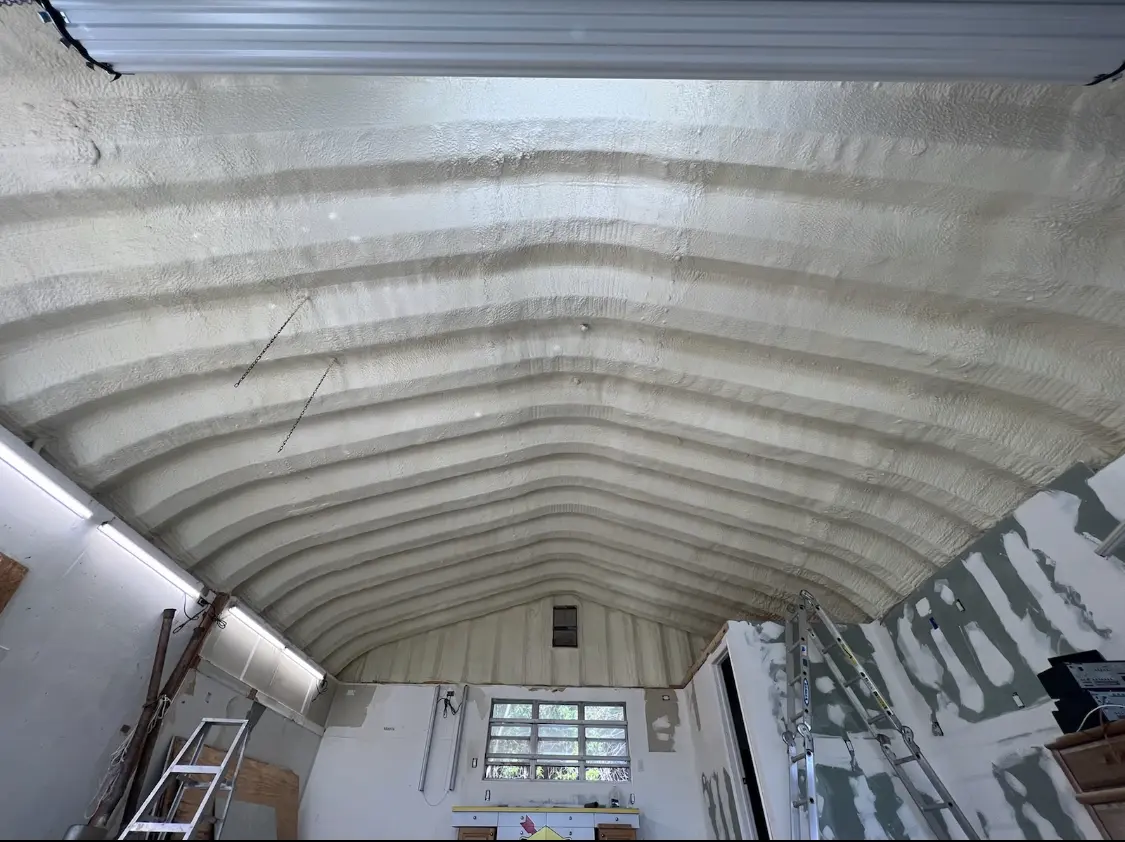 Spray polyurethane foam applied to the underside of a metal roof deck in Hoquiam
